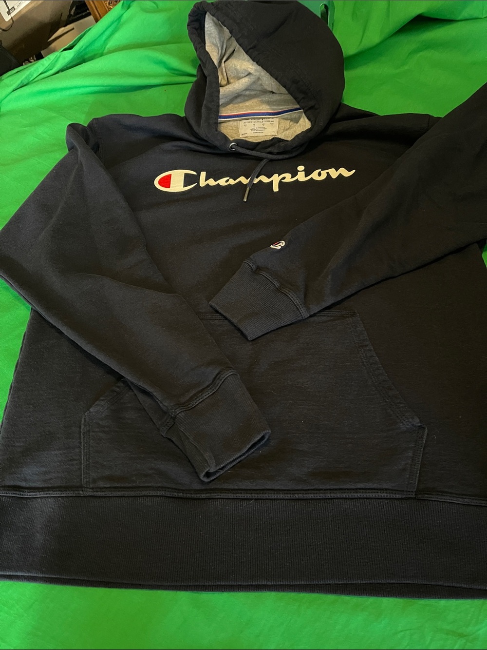 Champion Black Hoodie with Script Logo and Red Accent